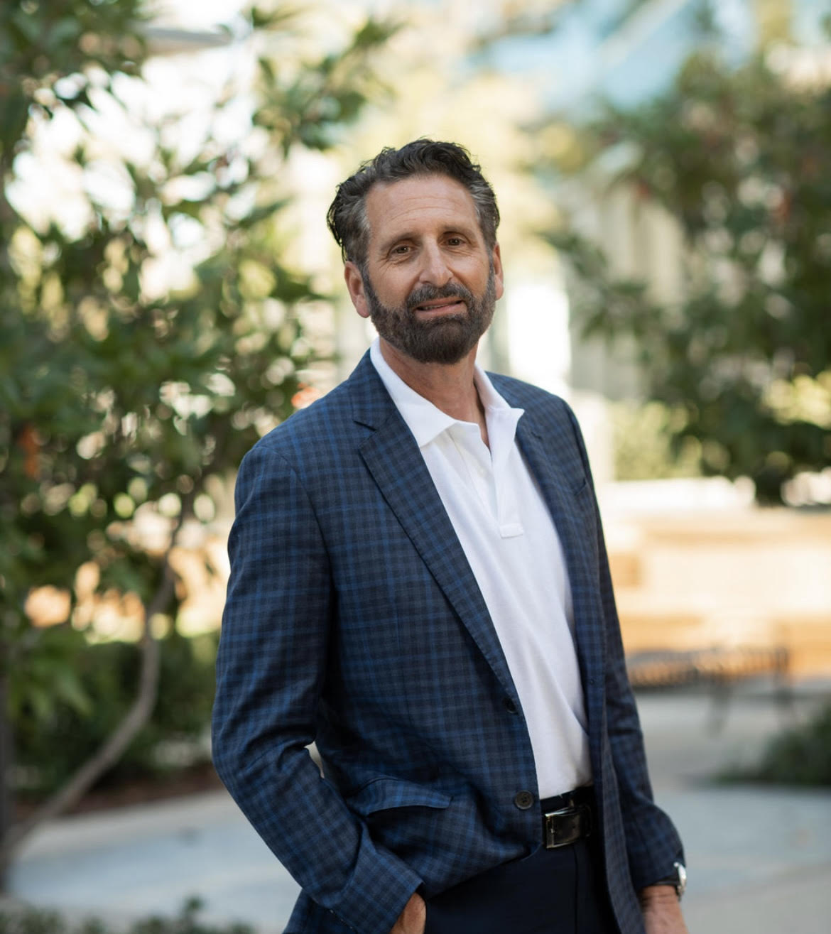 Guy Marcozzi, wearing a navy plaid blazer, photographed outdoors